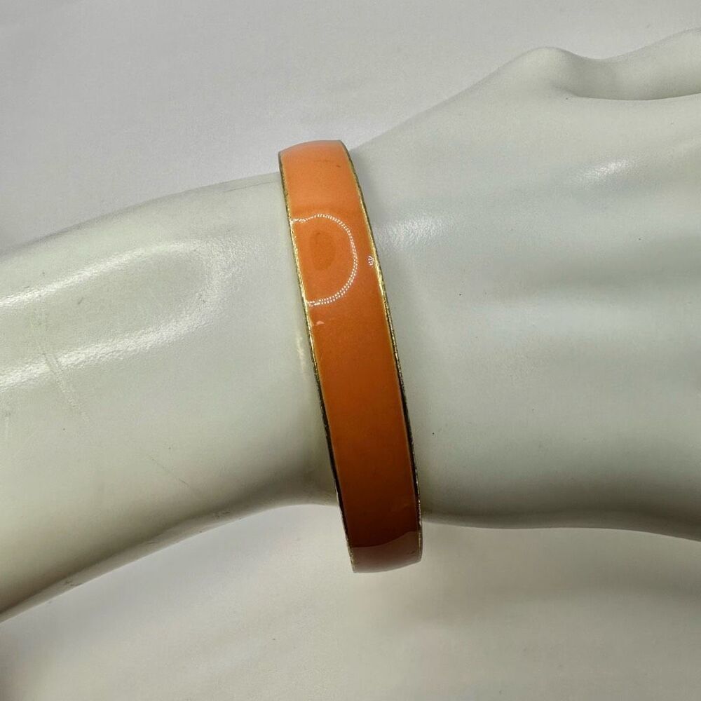 Orange enamel gold tone bangle bracelet